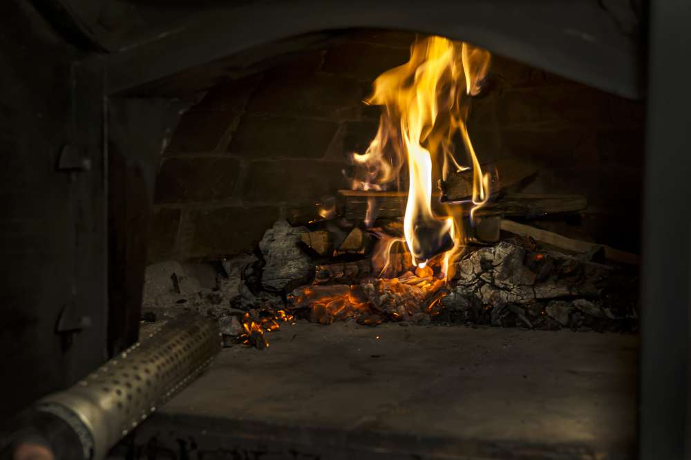 What kind of wood should I use in my wood fired pizza oven?